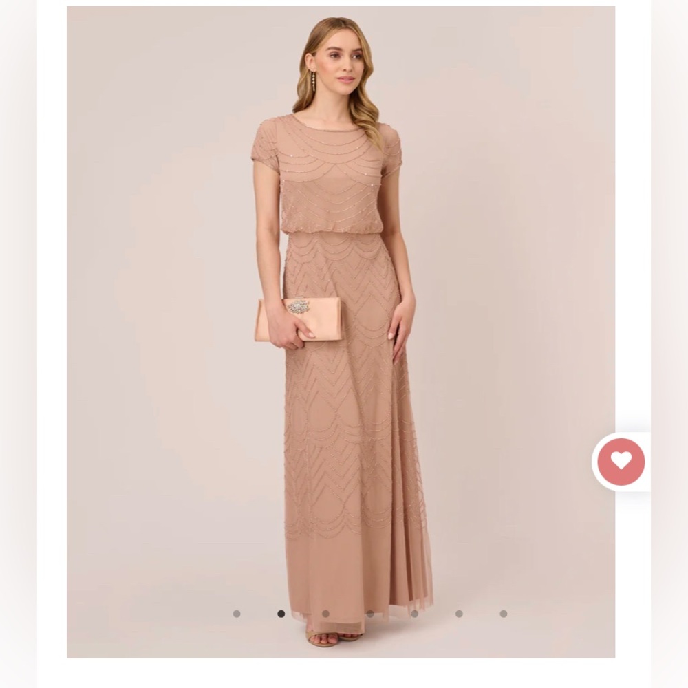 Used once Adriana Parpell short sleeve long beaded dress so comfortable.